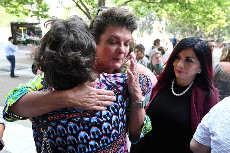 Women embrace outside the Federal Court in Sydney when the vaginal mesh class action judgement was handed down last November.