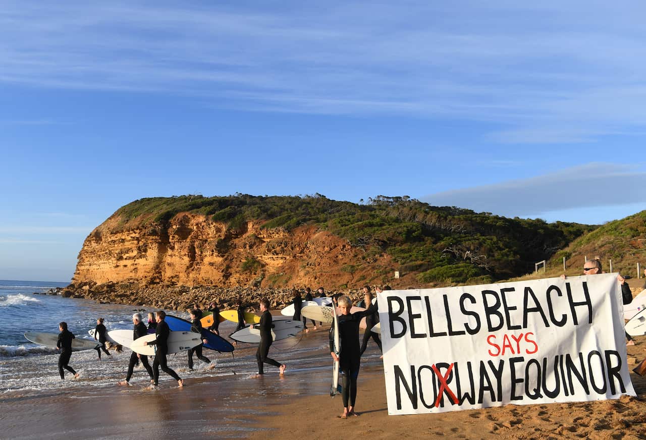 Surfers protest at Bells Beach as part of a National Day of Action against Equinor and its plans to drill for oil in waters off the Great Australian Bight.