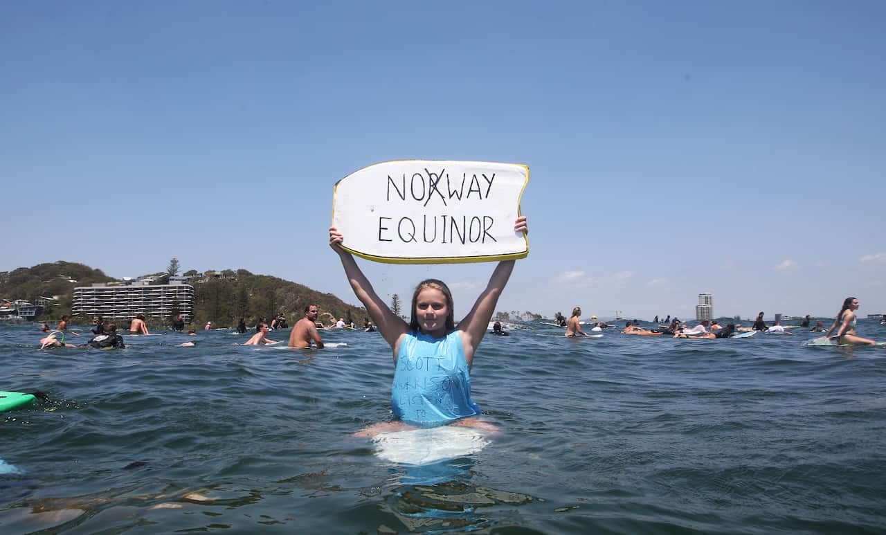Anti-oil drilling protesters gathered at Currumbin on Queensland's Gold Coast as part of a national protest action against Equinor's oil exploration plans.