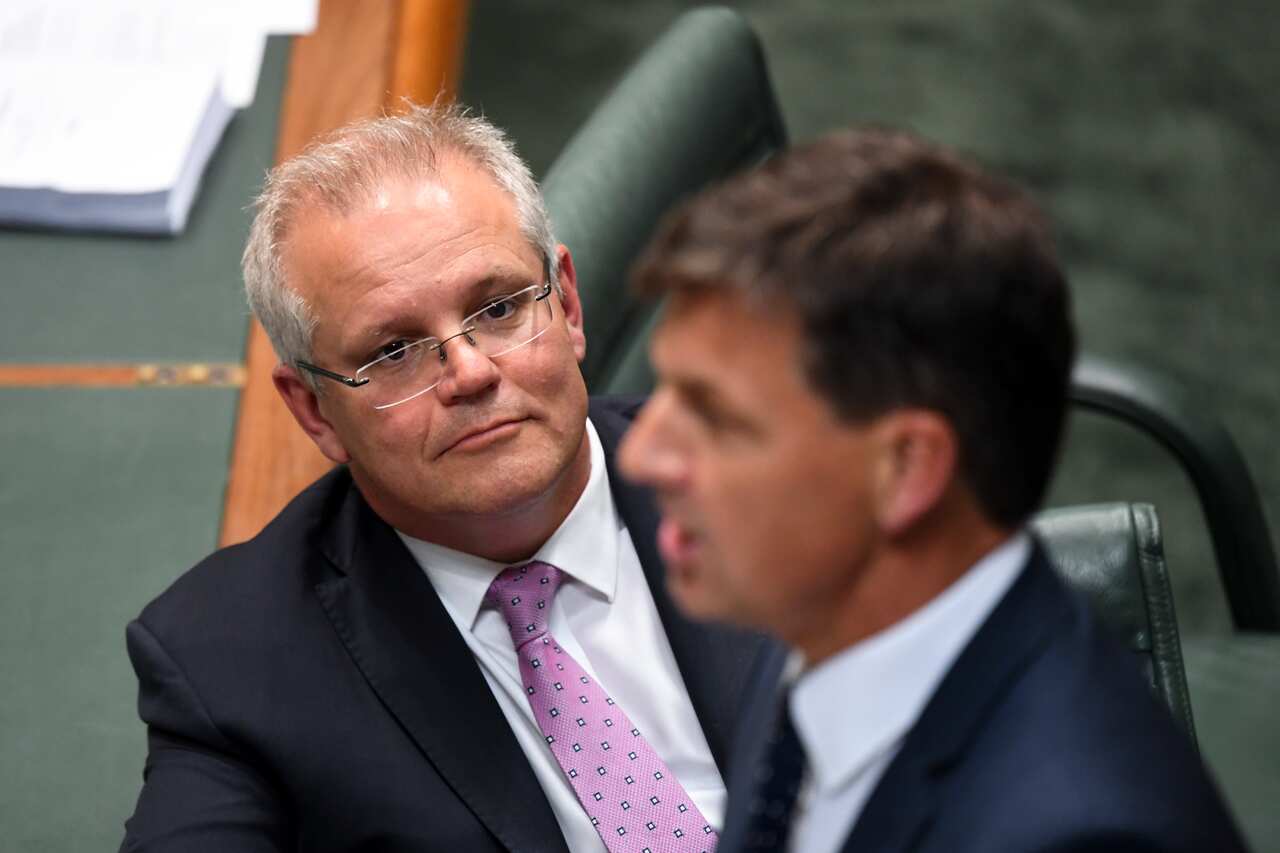 Australian Prime Minister Scott Morrison listens to Australian Energy Minister Angus Taylor during House of Representatives Question Time at Parliament House in Canberra, Tuesday, November 26, 2019. (AAP Image/Lukas Coch) NO ARCHIVING