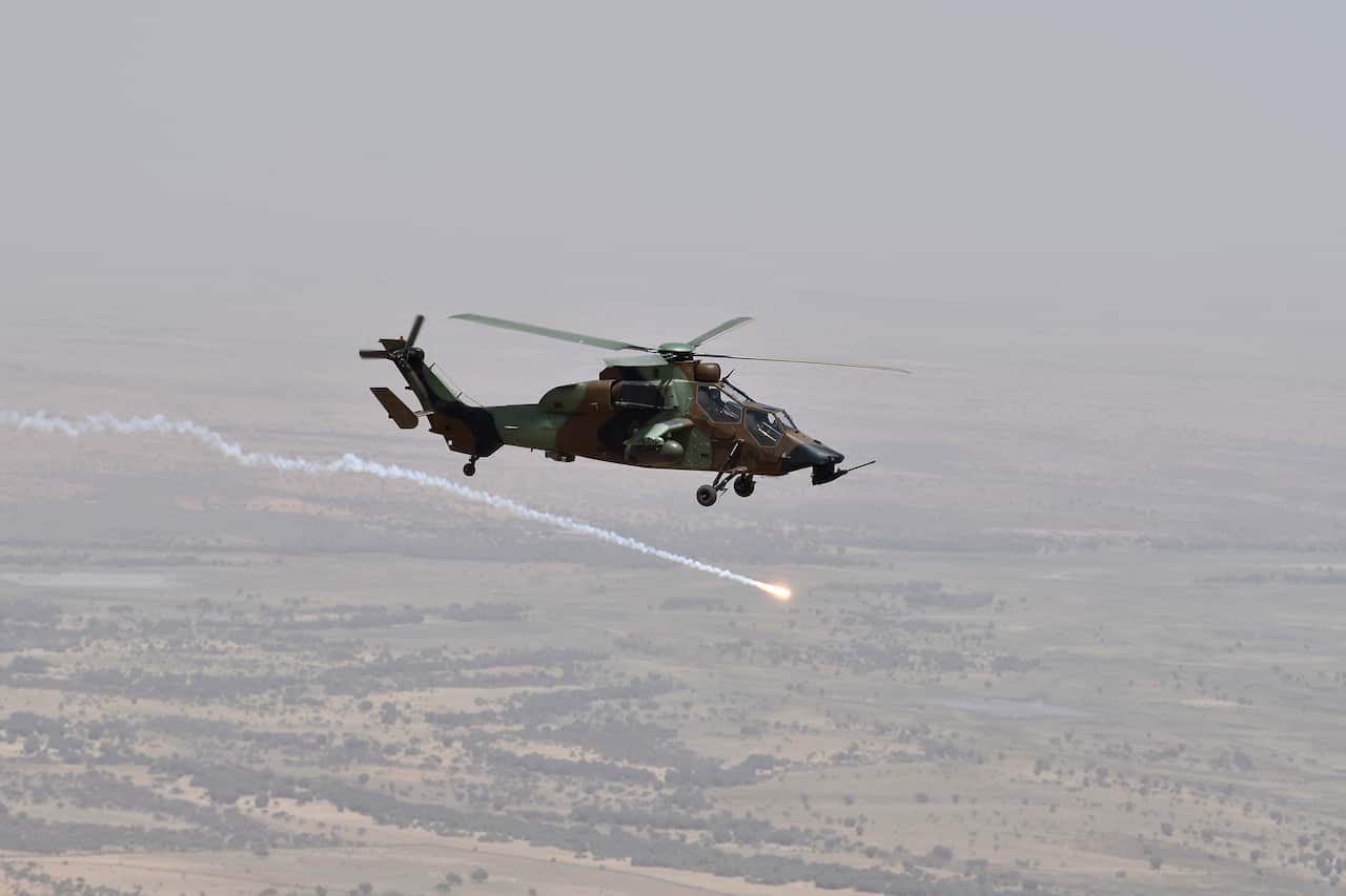 A French military helicopter flies over Gao in eastern Mali in 2017.