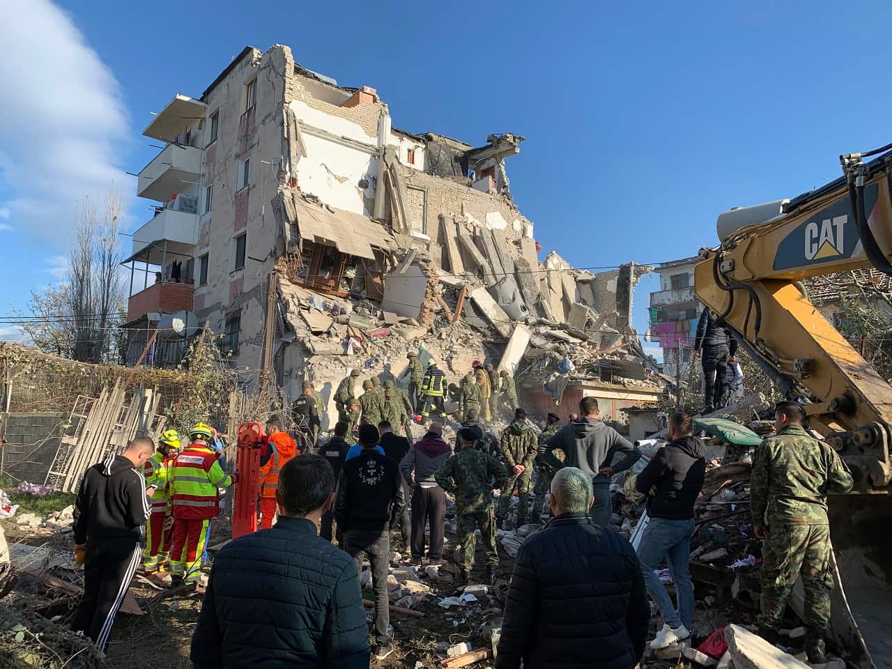 Rescuers search at a damaged building after the magnitude 6.4 earthquake.