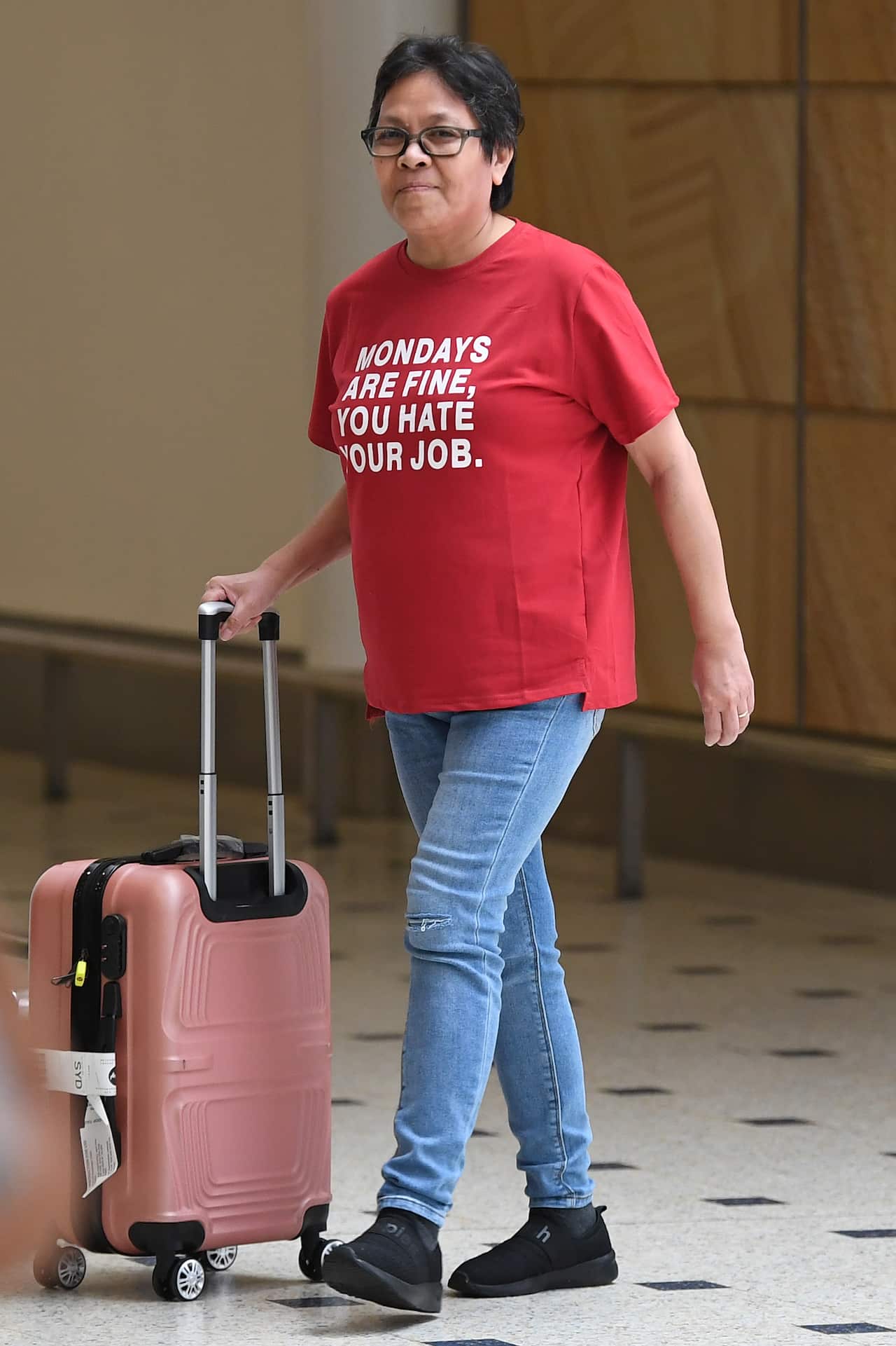Maria Exposto arrives at Sydney International airport.
