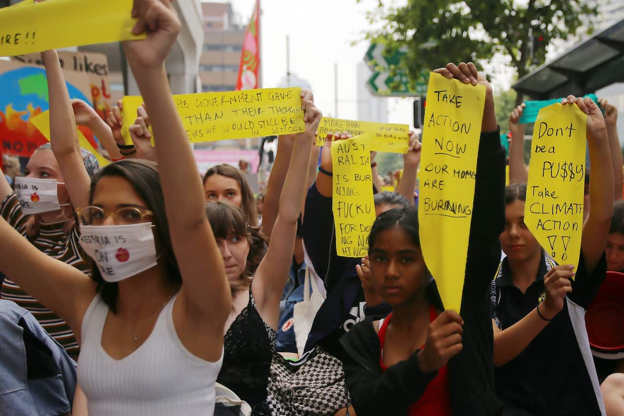 Student activists hold a 'solidarity sit-down' outside of the office of the Liberal Party of Australia in Sydney last November.