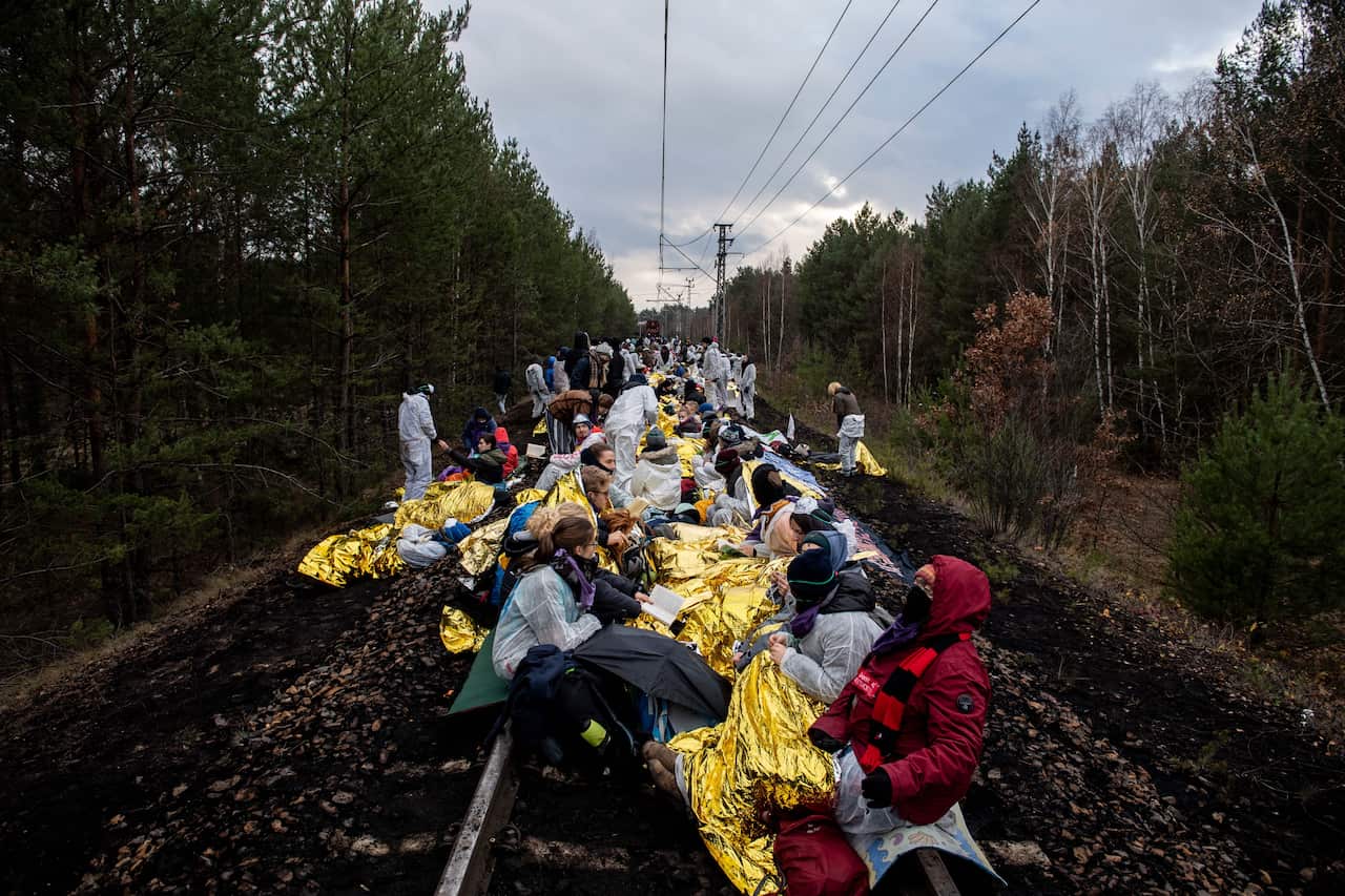 Climate activists block the rail line to the coal-fired power plant Jaenschwalde, near Cottbus in Germany, 30 November 2019. 