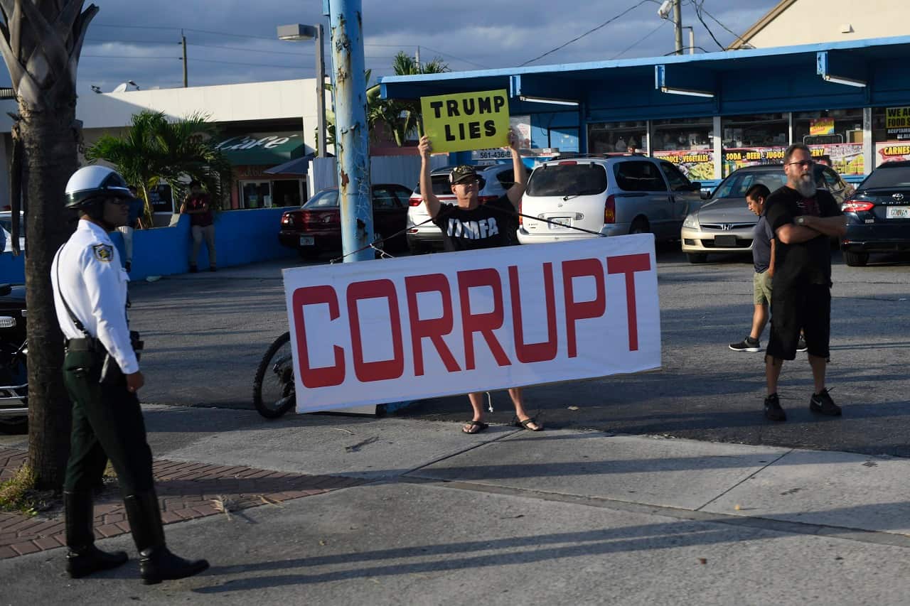 People protest Donald Trump in Florida on Sunday.