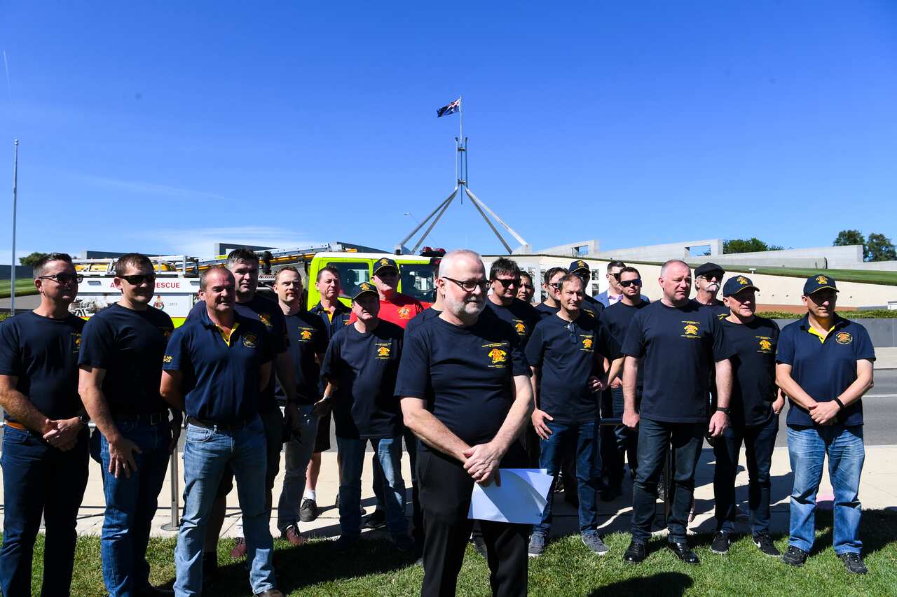 Members of the United Firefighters Union of Australia during a rally demanding a national approach to climate change in Canberra, December 2019.