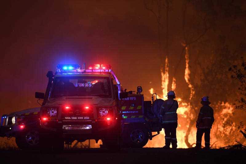 NSW Rural Fire Service crews as the Three Mile fire approaches Mangrove Mountain north of Sydney, Thursday, December 5, 2019.