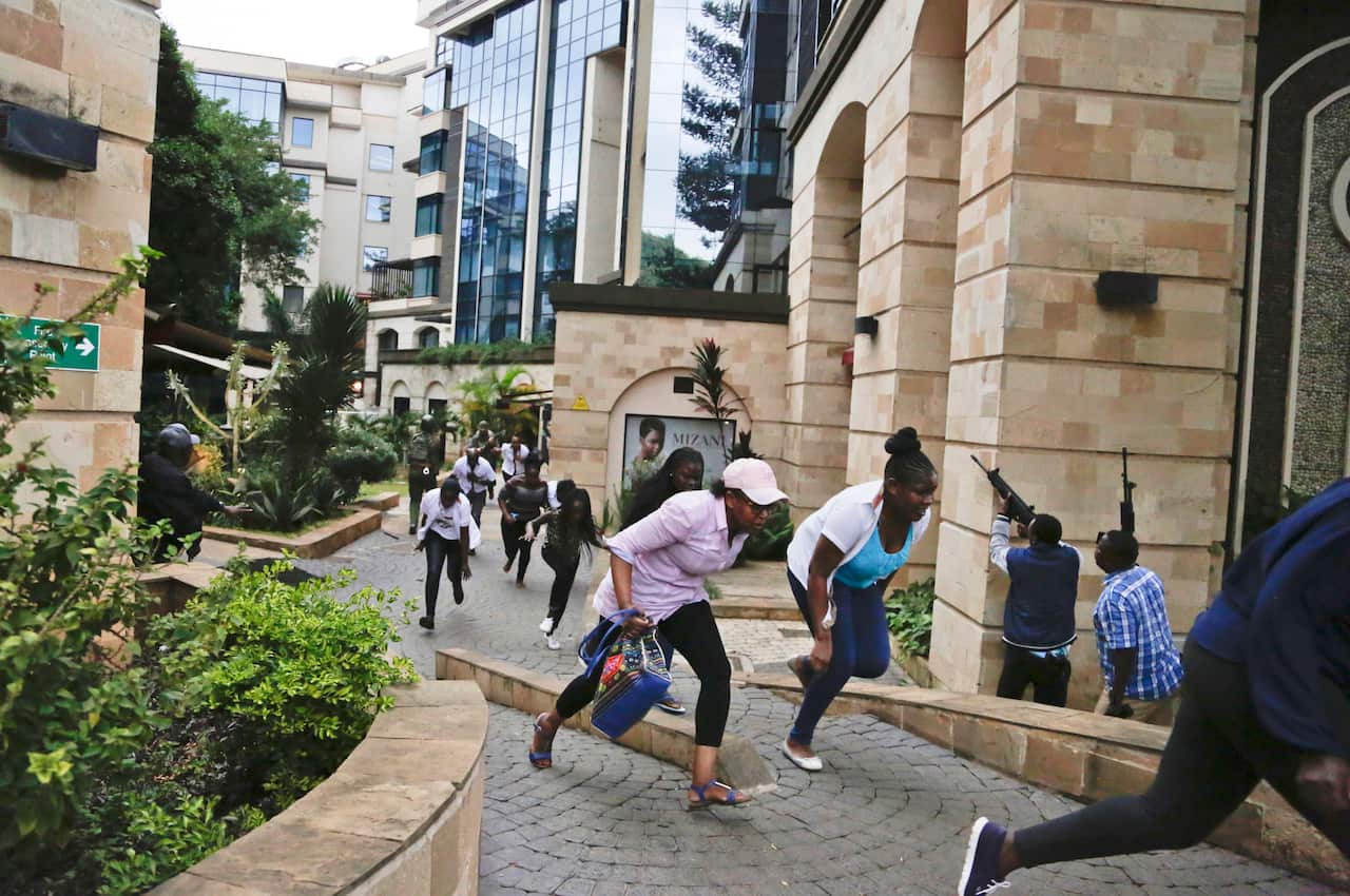 People flee during a deadly extremist attack at a luxury hotel complex in Nairobi, Kenya last year. 