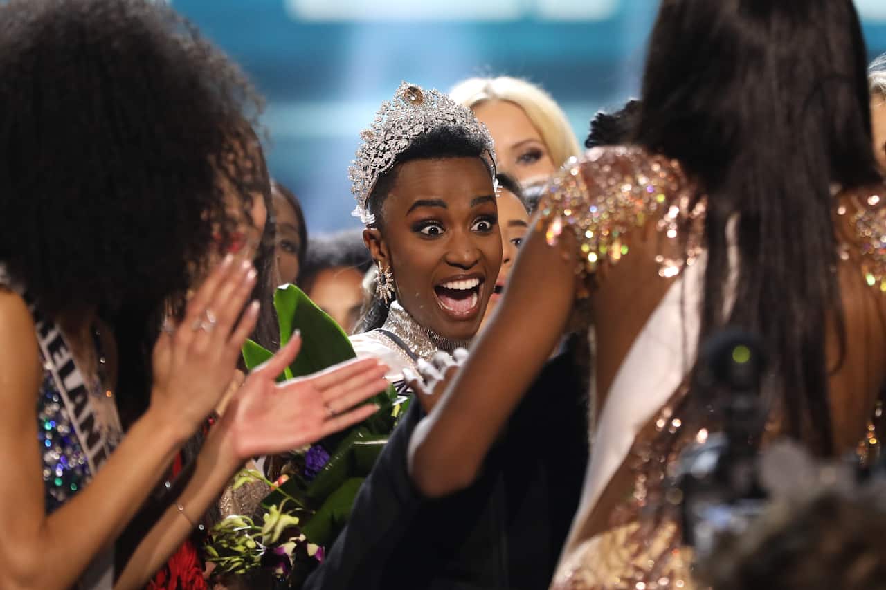 Miss South Africa Zozibini Tunzi reacts after being crowned Miss Universe 2019.