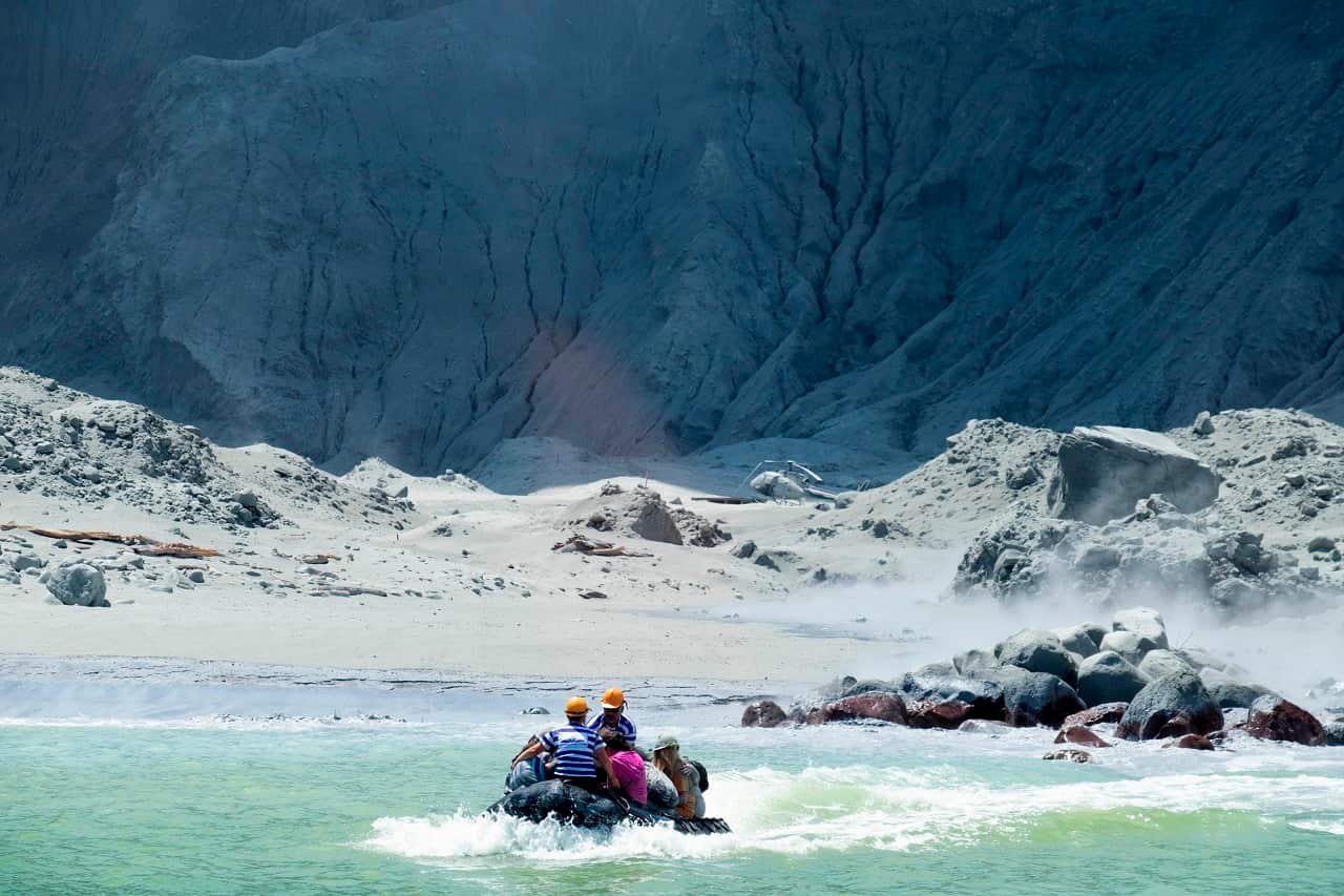 A rescuers' boat leaving the island following the eruption on Monday.