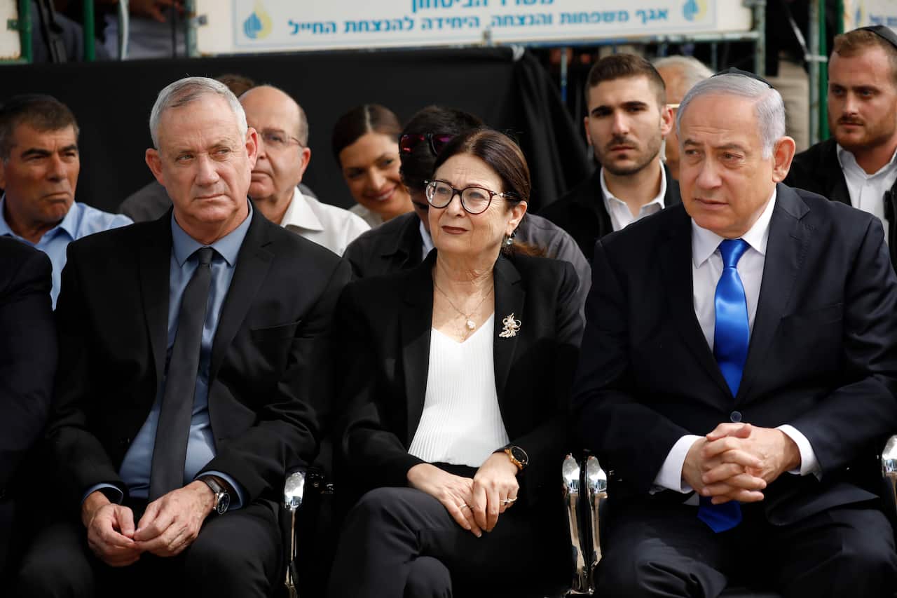 Benny Gantz, left, Esther Hayut, the Chief Justice of the Supreme Court of Israel, and Israeli Prime Minister Benjamin Netanyahu.