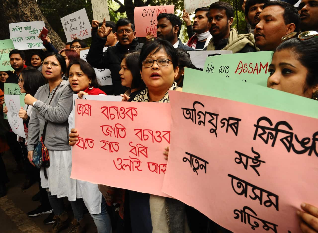 Protesters from northeast India residing in the capital city shout slogans against the government's Citizenship Amendment Bill 2019.