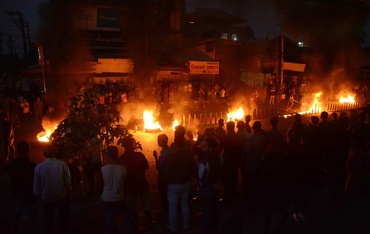 Protesters burn tries on road they protest against the Citizenship Amendment Bill 2019 in Guwahati Assam, India.