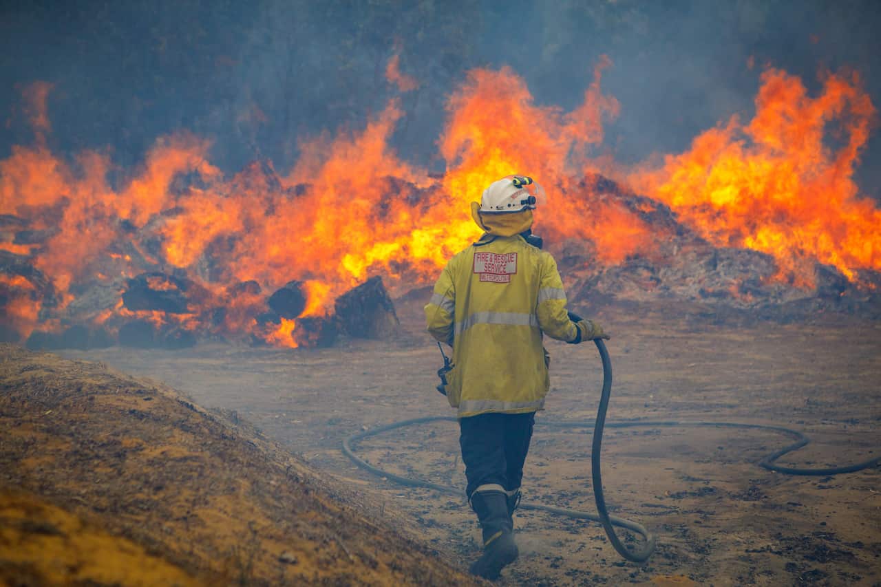 A firefighter battling a blaze in Yanchep, Western Australia.
