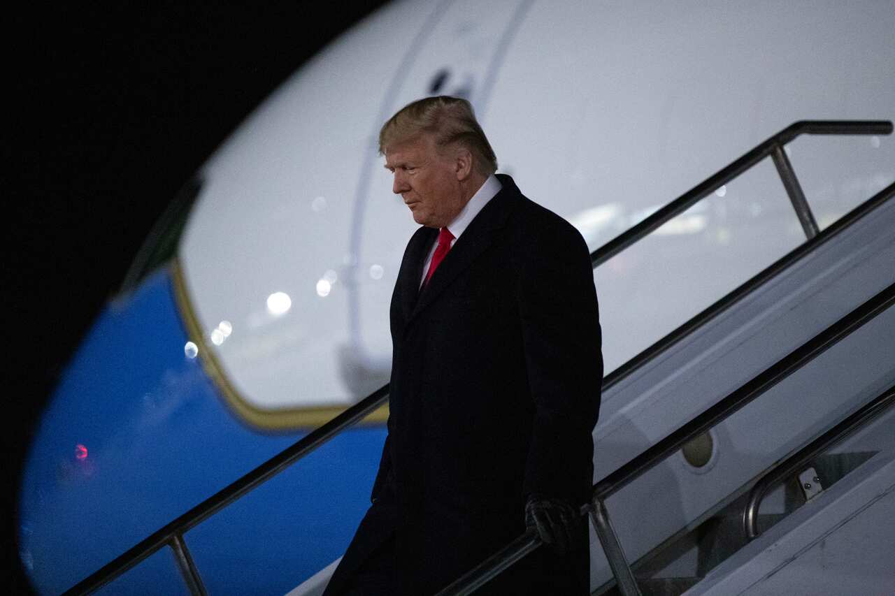 Donald Trump lands in Michigan, set to attend a campaign rally while the House voted on his impeachment.
