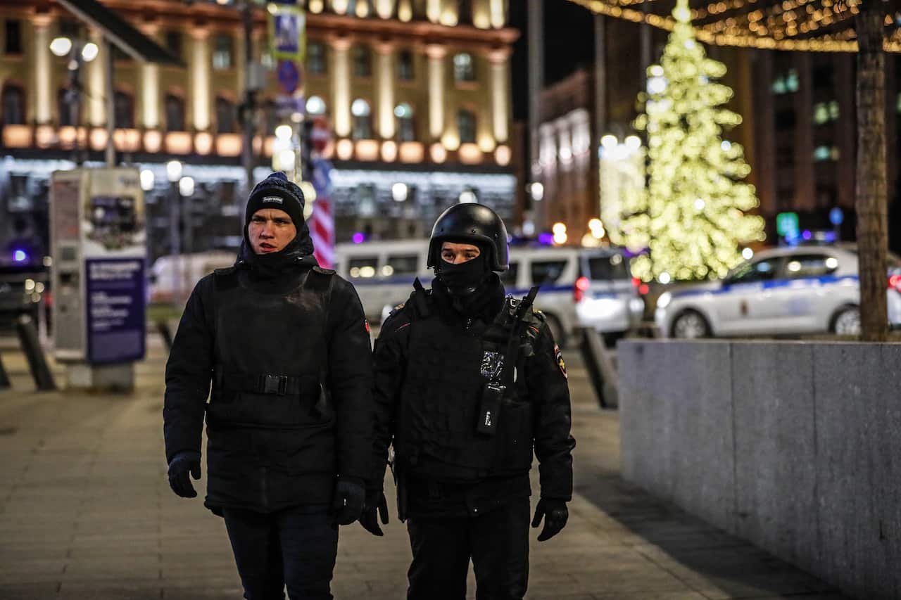 Russian policemen guard in front of the Federal Security Service of the Russian Federation (FSB) headquarters where unknown men opened fire in Moscow.