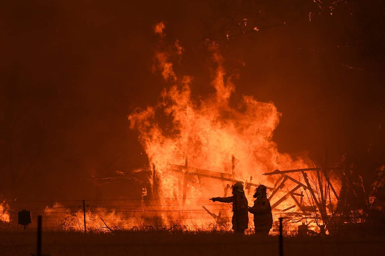 NSW Rural Fire Service crews fight the Gospers Mountain Fire.