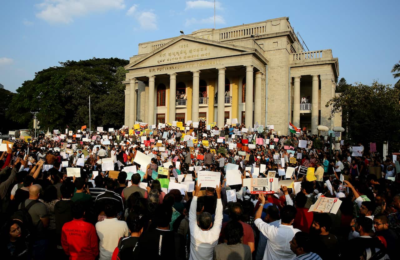 Protesters holds placard and shouts slogans during a protest in solidarity against the Citizenship Amendment Bill (CAB) and National Register of Citizens (NRC).