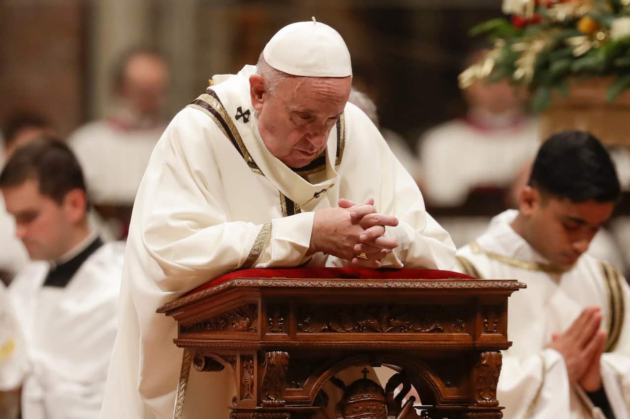 Pope Francis prays as he celebrates Christmas Eve Mass in St. Peter's Basilica at the Vatican, Tuesday, Dec. 24, 2019. (AP Photo/Alessandra Tarantino)