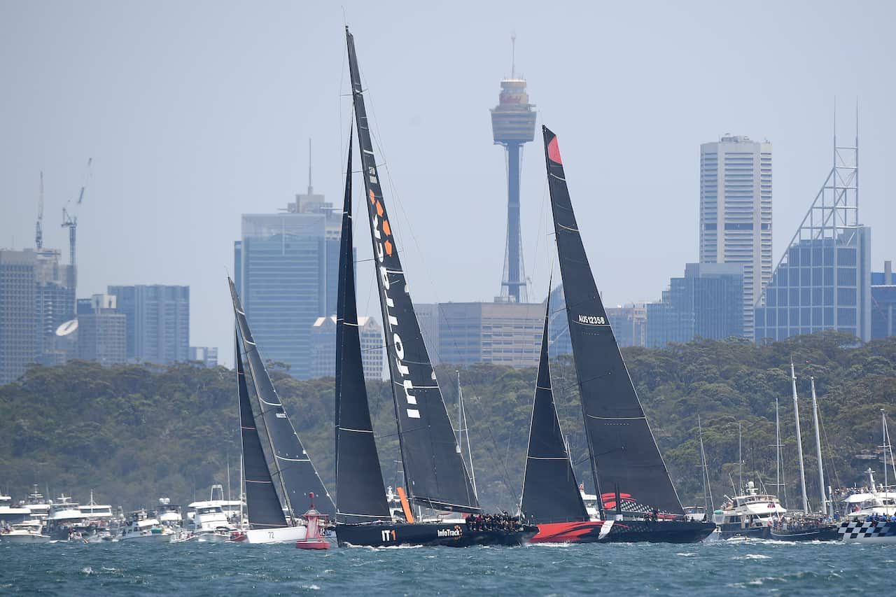 InfoTrack (second left) and Comanche are seen at the start of the Sydney to Hobart Yacht race in Sydney, Thursday, December 26, 2019. (AAP Image/Dan Himbrechts) NO ARCHIVING, EDITORIAL USE ONLY