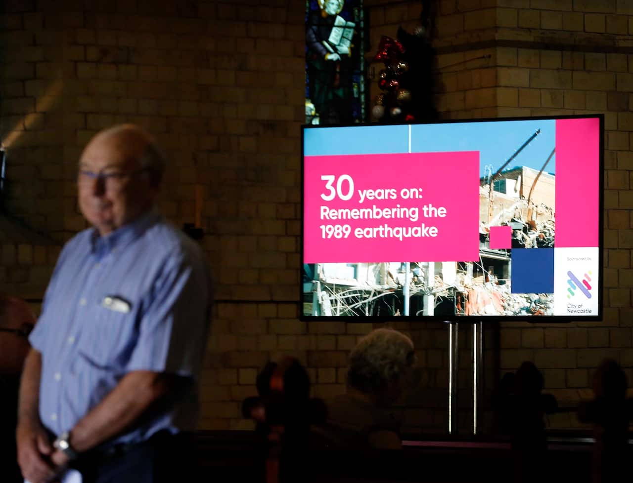A man arrives at Christchurch Cathedral in Newcastle for a service to commemorate the 13 victims who died in the 1989 earthquake.