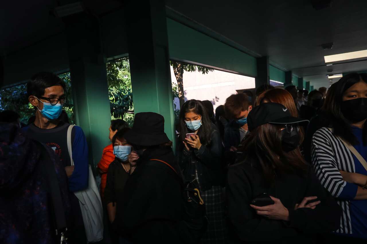 Protesters gather on a pedestrian bridge during a protest at Sheung Shui in Hong Kong.