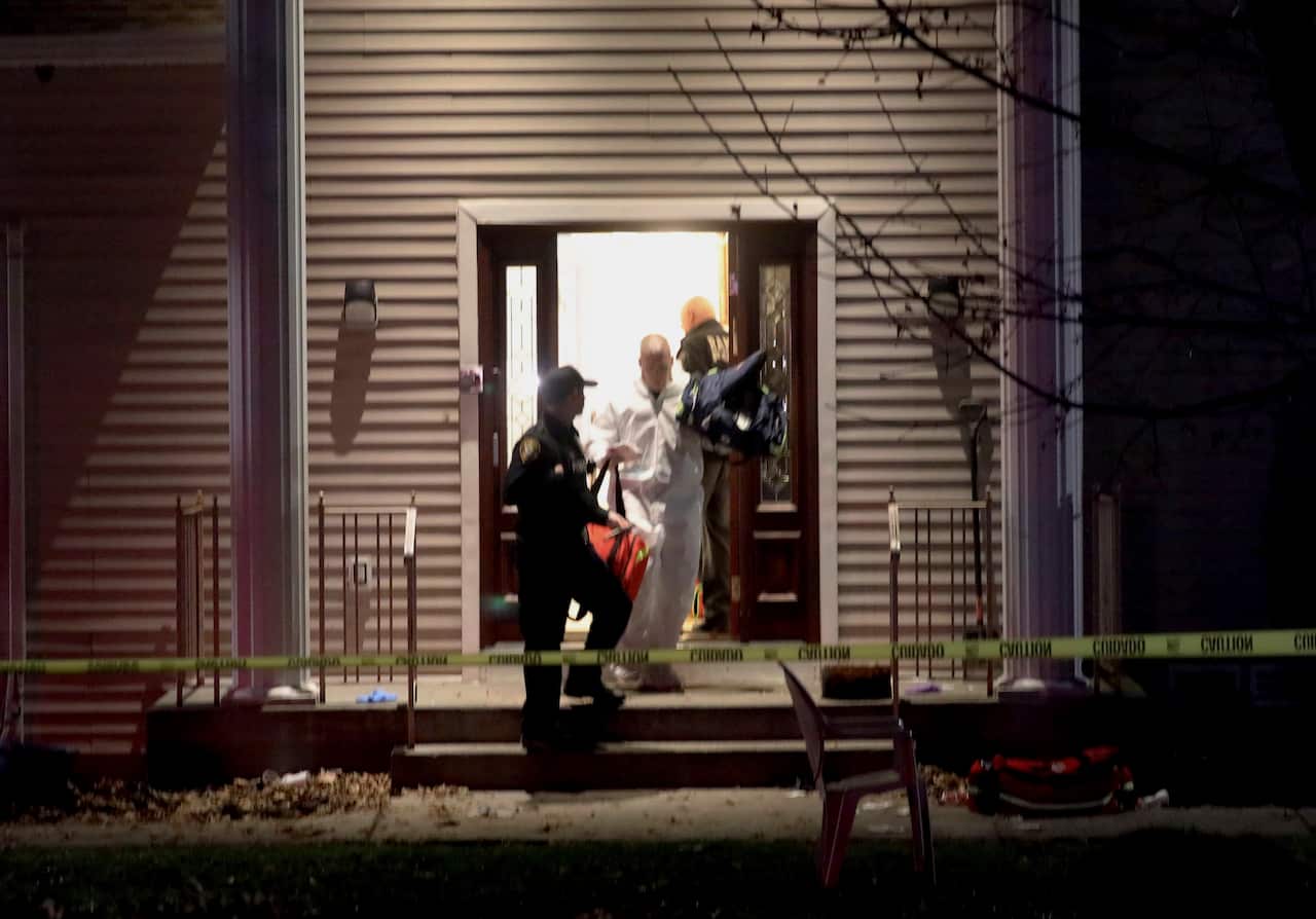 Police work at the home of a rabbi in Monsey, New York after a man entered the house and stabbed multiple people who were there for a Hanukkah gathering.