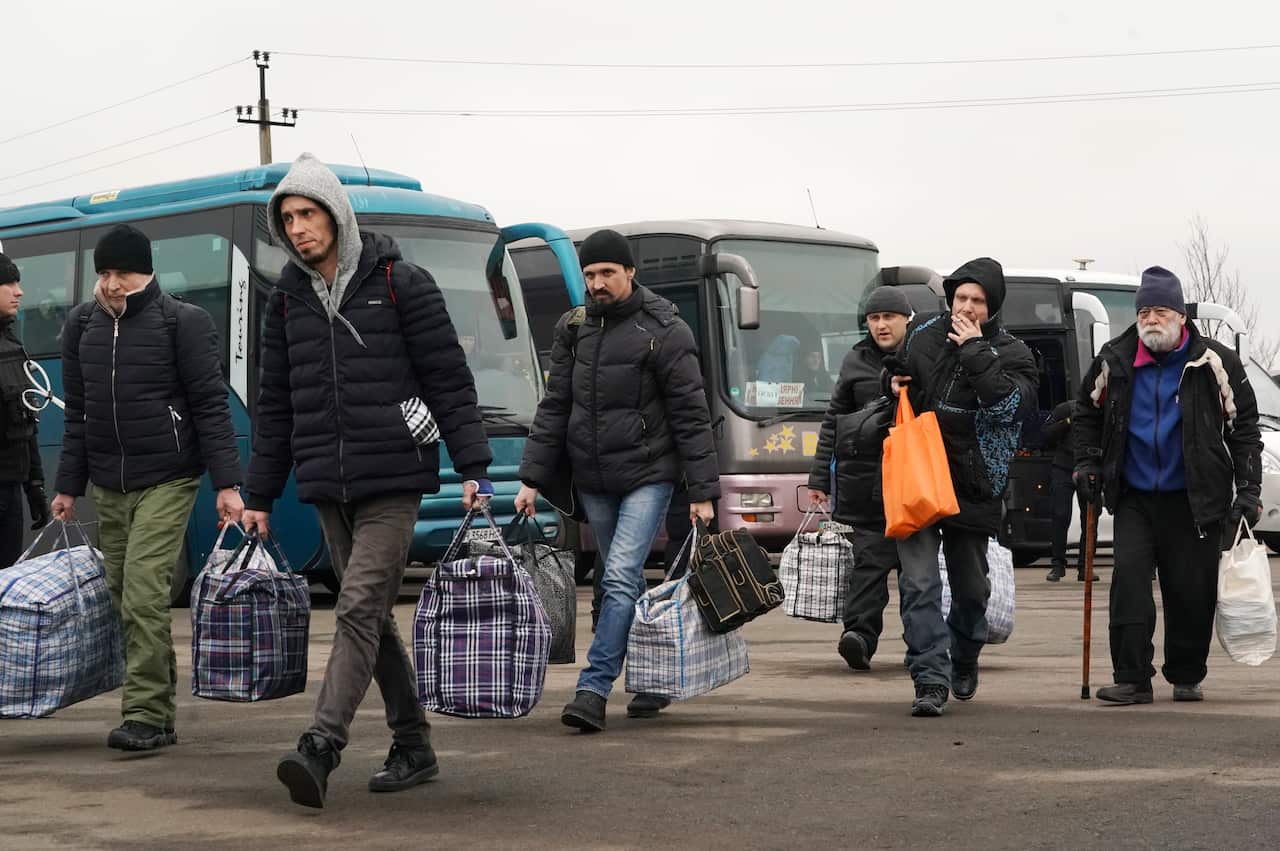 Russia-backed separatists war prisoners walk free after being released after a prisoner exchange.