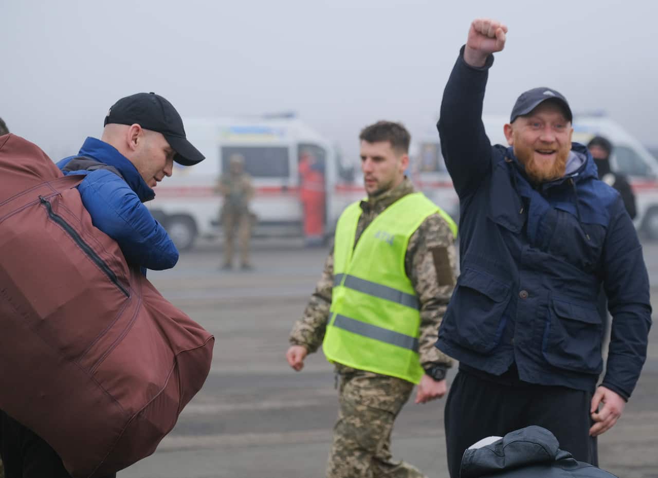 A prisoner cheers before a prisoner exchange between Ukrainian and pro-Russian rebels' sides.