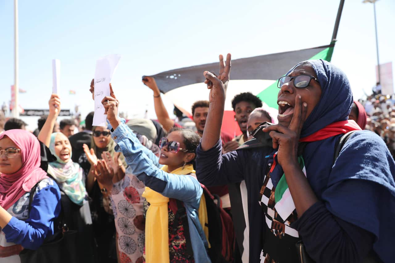 Sudanese people gathered outside the court as the 27 agents were sentenced to death. 