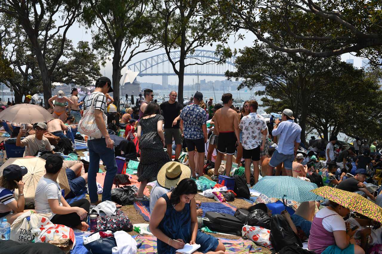 Crowds gather at Mrs Macquarie's Chair before tonight's New Years Eve fireworks in Sydney.
