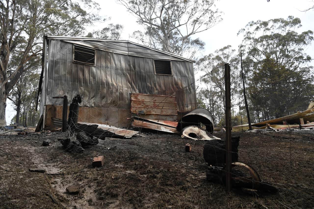 Damaged property is seen at a burnt-out residence in Sarsfield, East Gippsland, Victoria.