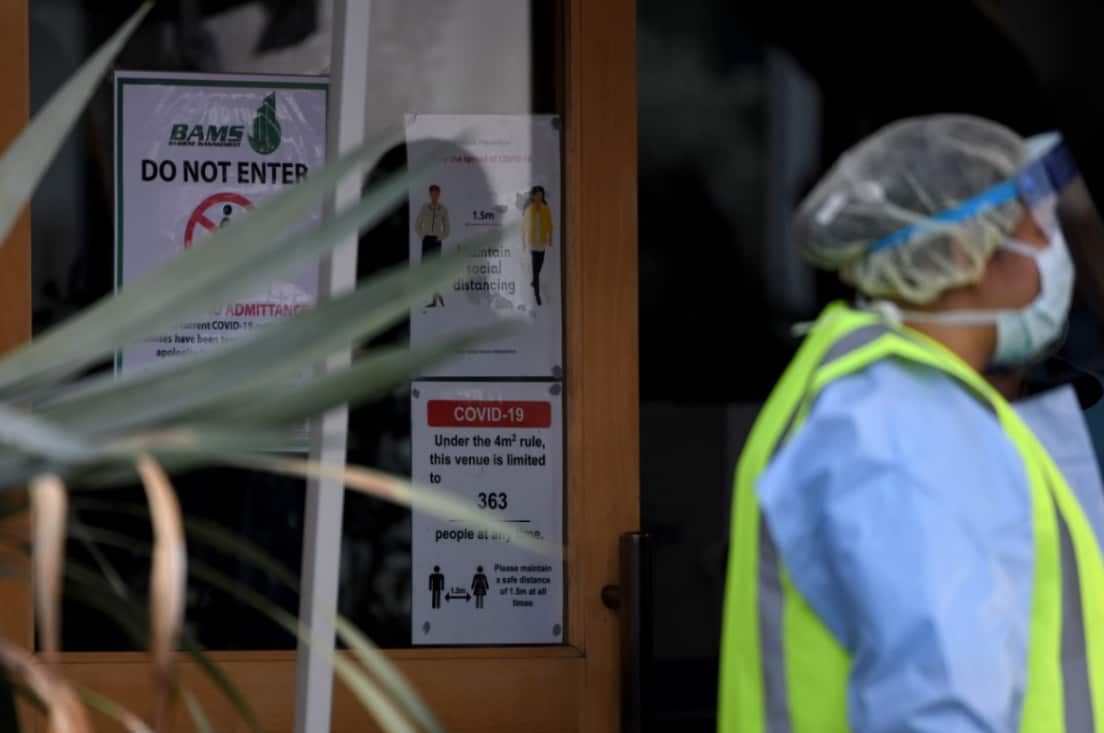 COVID-19 and social distancing signage is seen at the Crossroads Hotel in Sydney, Saturday, July 11, 2020