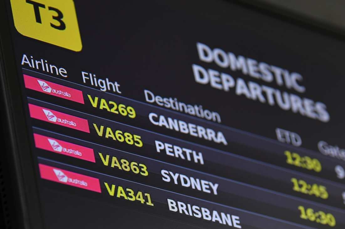 Electronic signage for Virgin Australia domestic departure flights is seen at Tullamarine Airport, Melbourne, Tuesday, April 21, 2020. 
