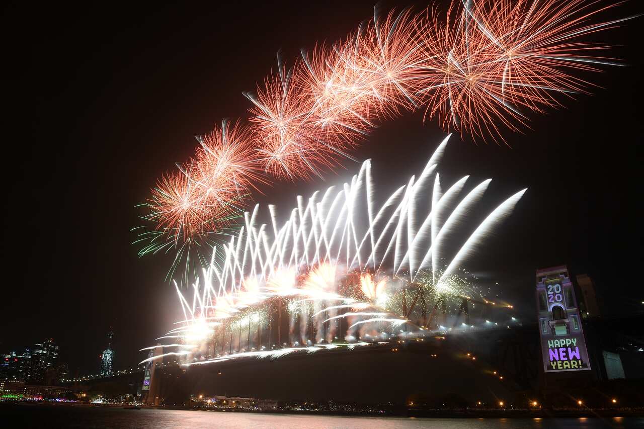 Fireworks explode above the Sydney Harbour Bridge, as seen from Kirribilli during New Year's Eve celebrations in Sydney, Wednesday, January 1, 2020. (AAP Image for City of Sydney/Dan Himbrechts) NO ARCHIVING, EDITORIAL USE ONLY