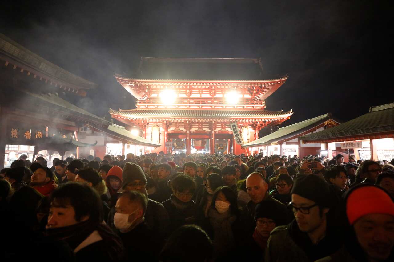 People gather at Sensoji temple as part of the New Year's celebration Wednesday, Jan. 1, 2020, in Tokyo. (AP Photo/Jae C. Hong)
