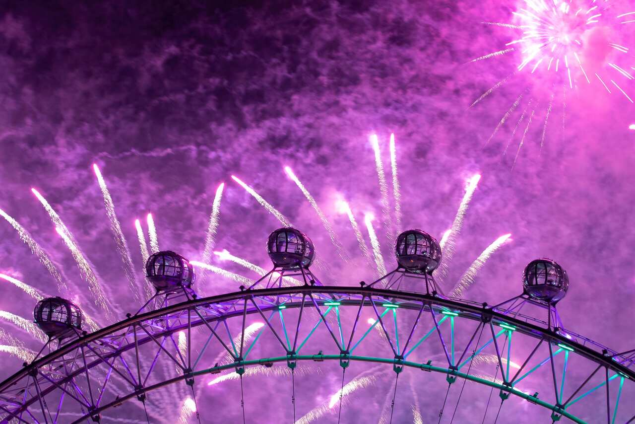 Fireworks explode over the London Eye Ferris wheel by the River Thames in London, to mark the start of the new year, Wednesday, Jan. 1, 2020. (Aaron Chown/PA via AP)