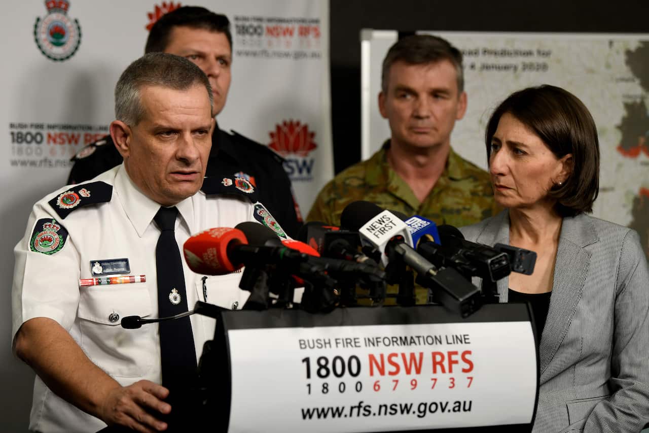 RFS Deputy Commissioner Rob Rogers (left) and NSW Premier Gladys Berejiklian (right) speak to the media.