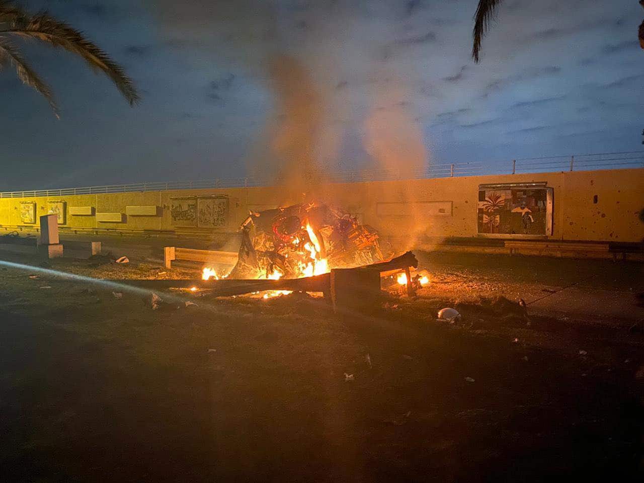 A burning vehicle near Baghdad International Airport, Iraq on Friday.