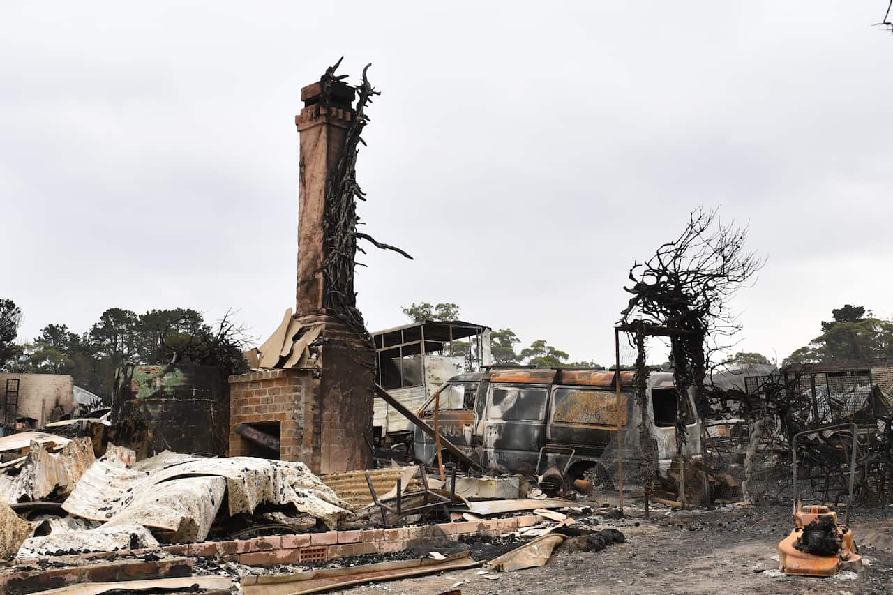 The burnt out remains of a house is seen from a bushfire in the Southern Highlands town of Wingello, 160km south west of Sydney.