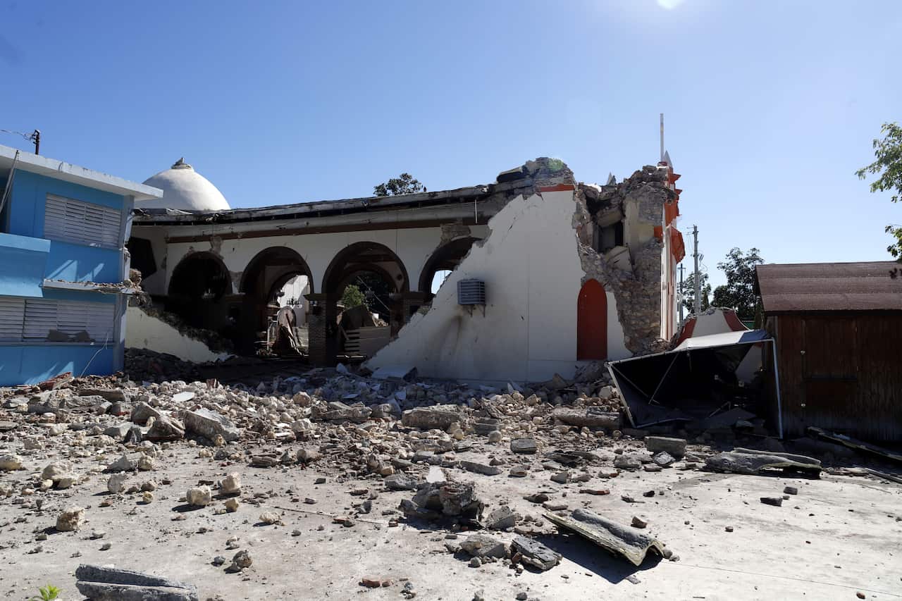 The Immaculate Conception parish is all but destroyed in the quake.