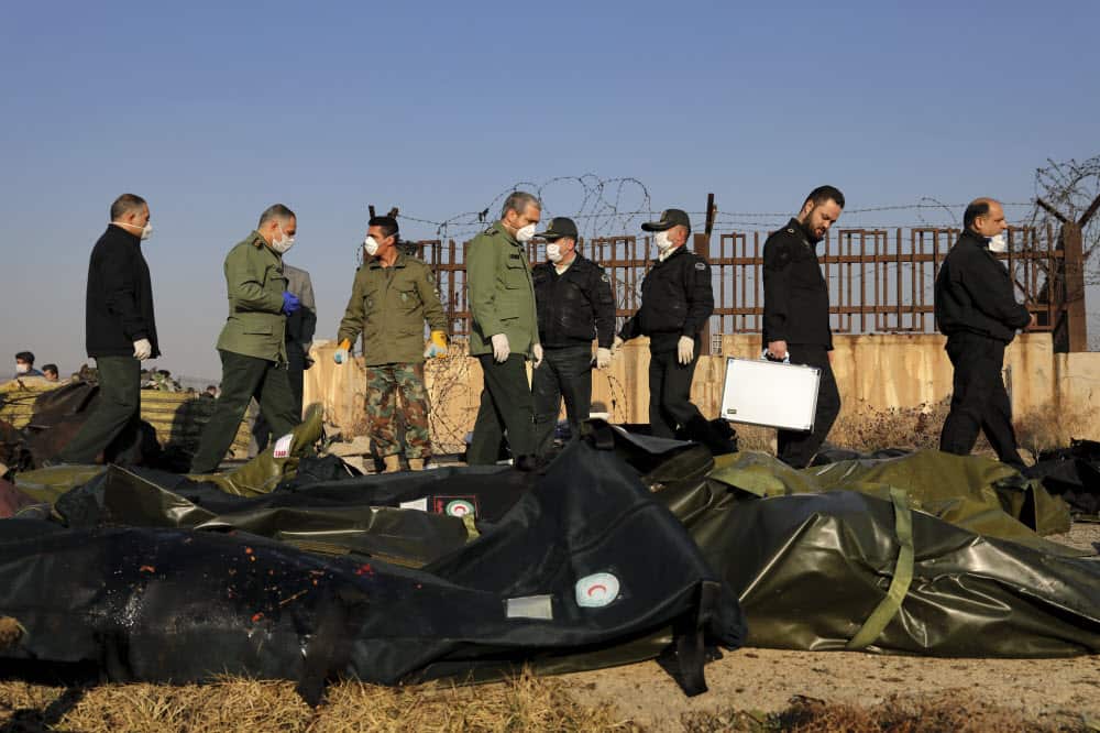 Security personnel work at the scene where a Ukrainian plane crashed in Shahedshahr, southwest of the capital Tehran, Iran