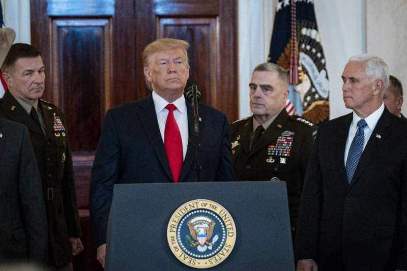 US President Donald Trump delivers a statement in the Grand Foyer of the White House