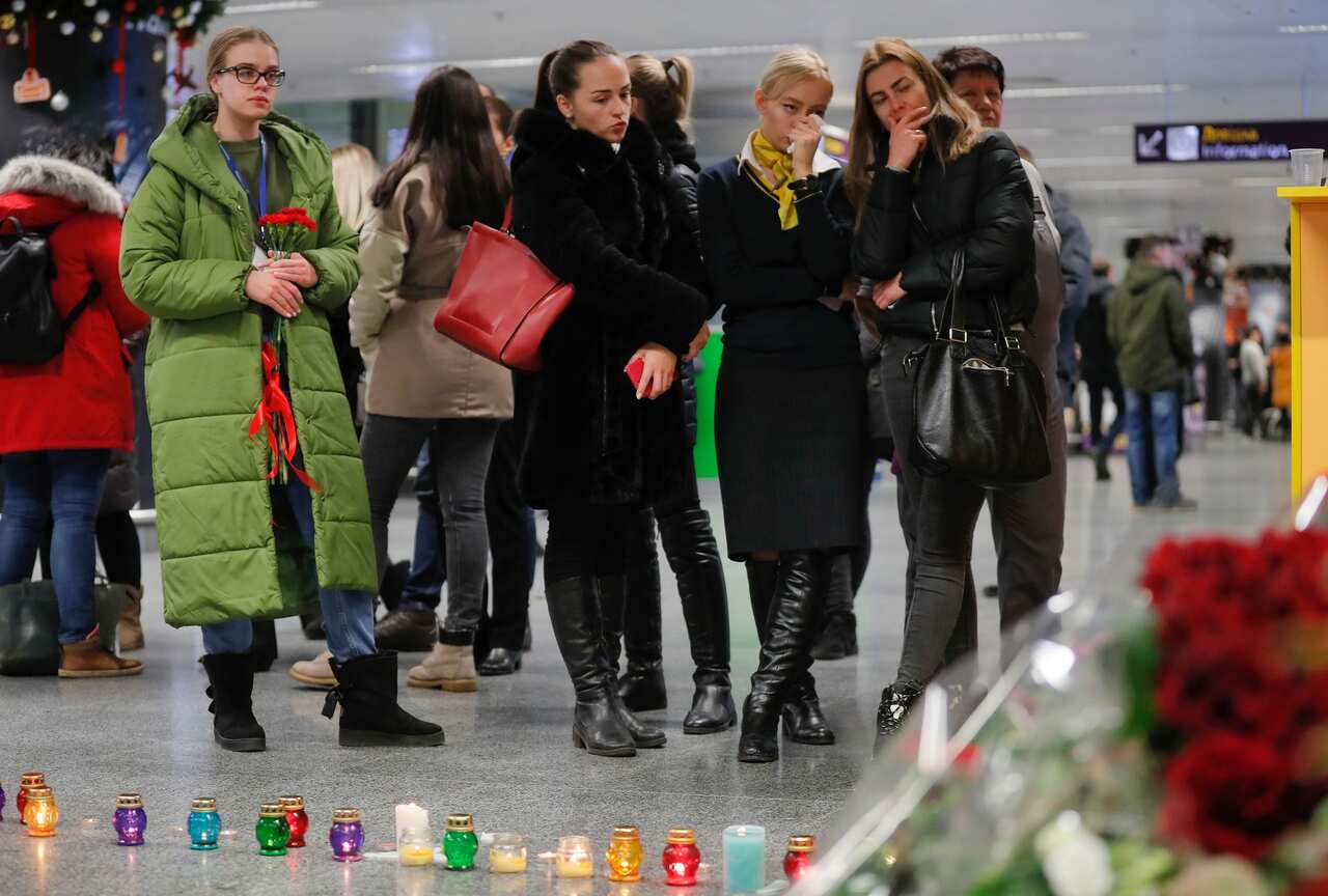 Relatives, colleagues, and friends of crew members of the Ukraine International Airlines Flight PS752 come together.