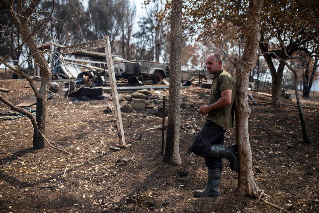Farmer Farren Terlich is seen on his burnt-out property in Verona, New South Wales.
