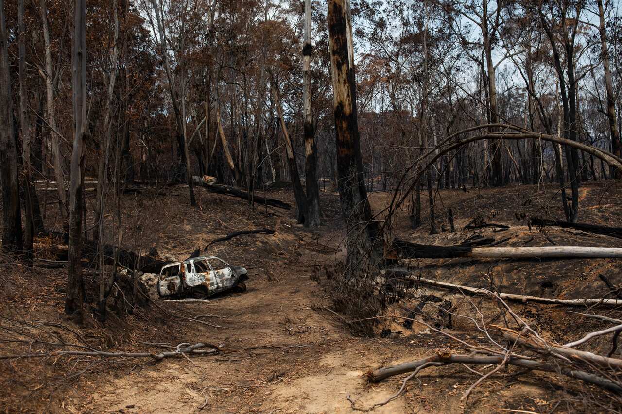 A burnt-out car is seen on a property in Verona, New South Wales, after bushfires tore through the region on New Years Eve 2019.