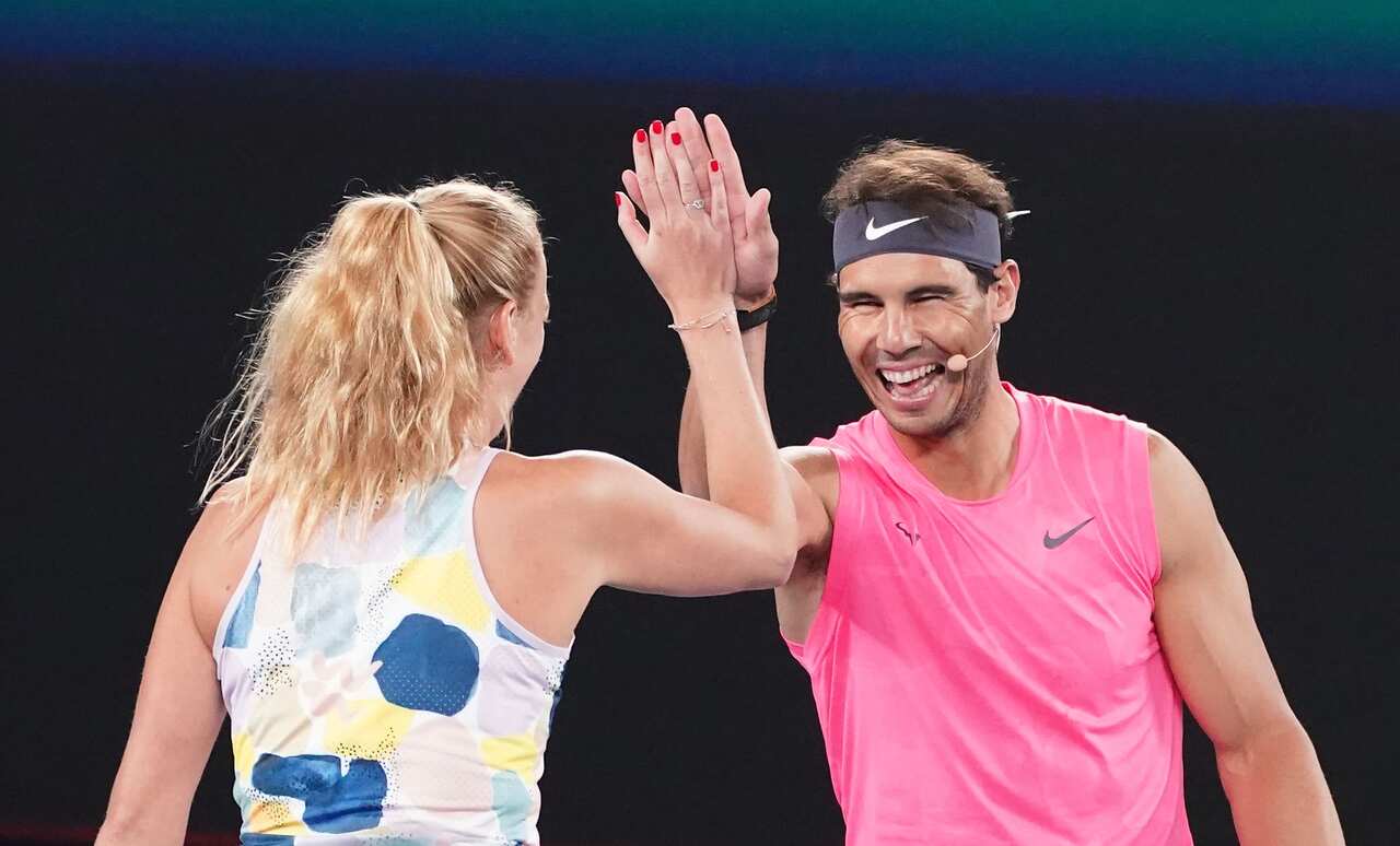 Rafael Nadal of Spain and Petra Kvitova of the Czech Republic celebrate during the Rally For Relief.