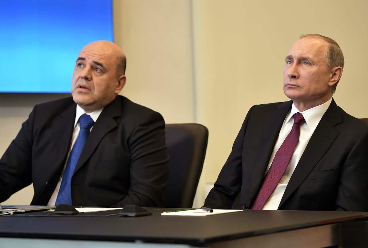 New Prime Minister Mikhail Mishustin (L) alongside Russian President Vladimir Putin (R).