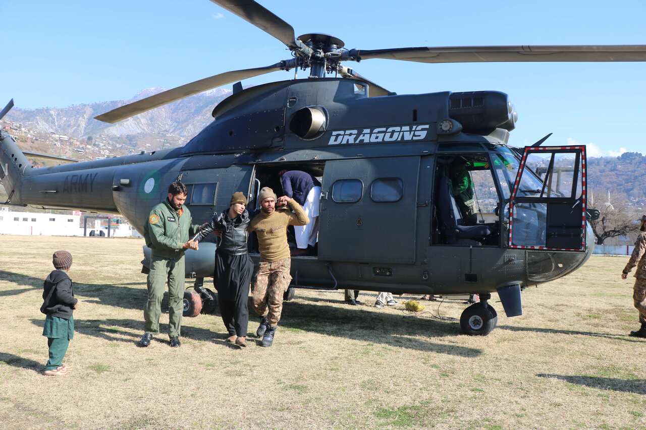 Pakistani Army soldiers shift injured victims of avalanche in Neelum Valley, in Muzaffarabad, Pakistani administered Kashmir.